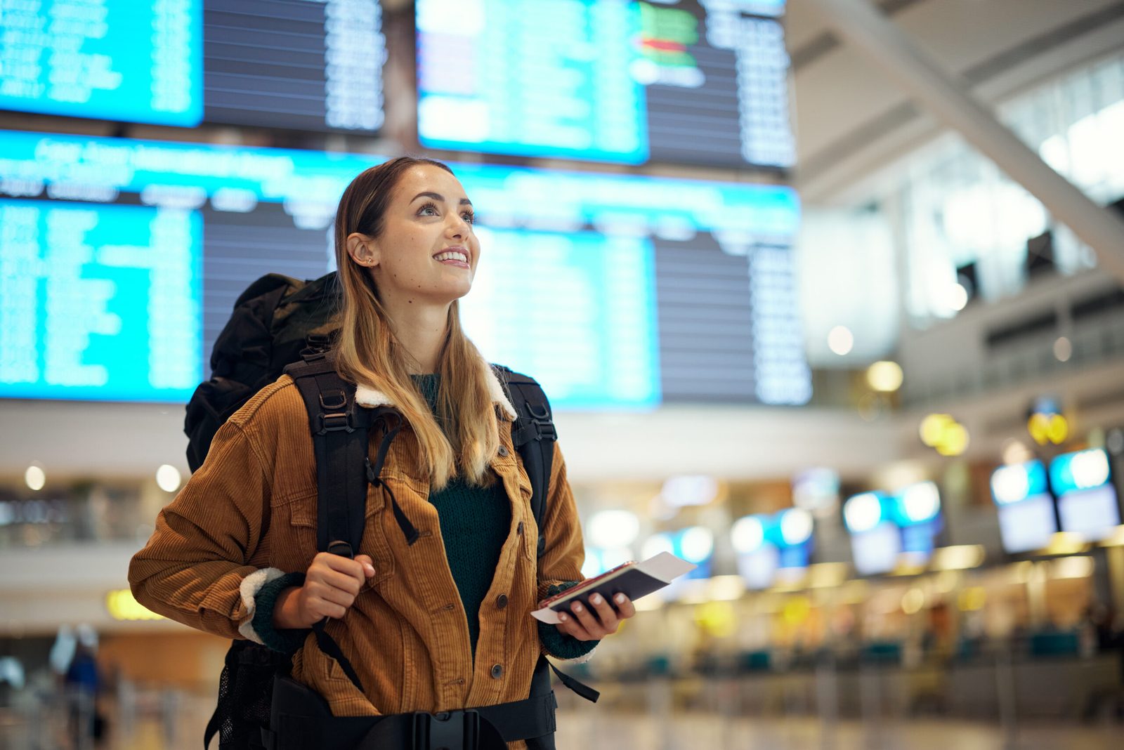 Traveler at the departures board — the journey reimagined end to end